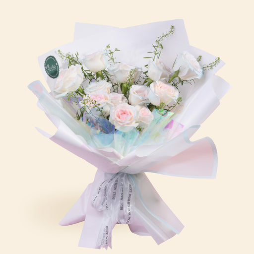 Bouquet with 12 stalks of Sprayed Pink Rose with Thlaspi, decorated in a pastel rainbow paper