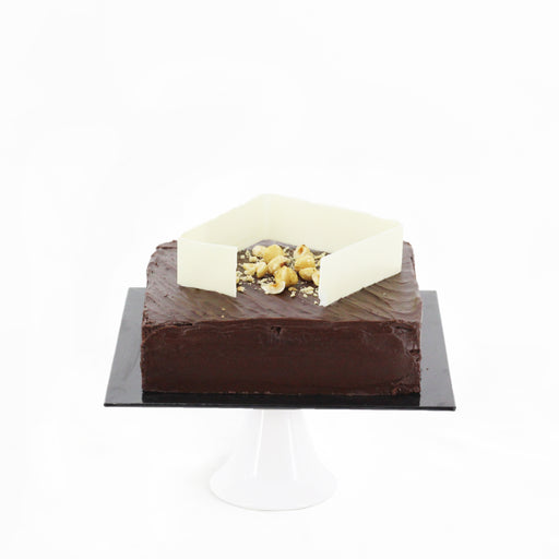 Angular chocolate hazelnut cake, topped with a thick strip of white chocolate