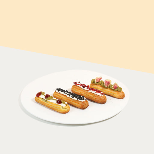 Four pieces of eclairs with different toppings