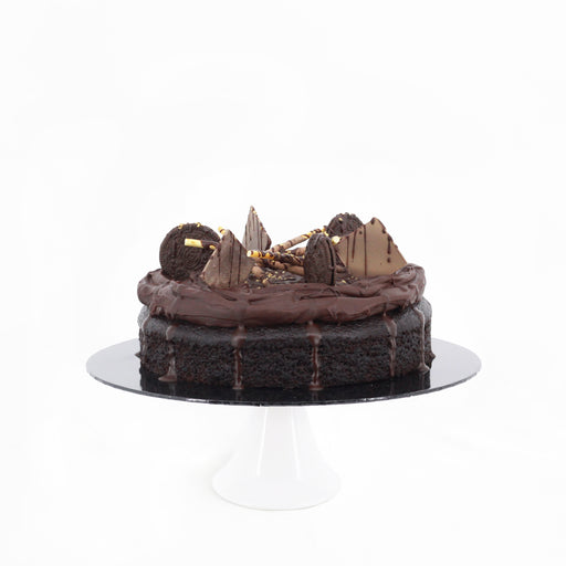 Chocolate cake topped with Belgian chocolate cream