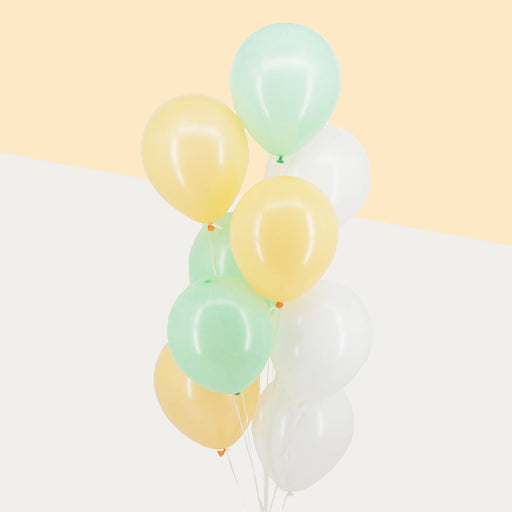 Pastel yellow, pastel green and white balloons