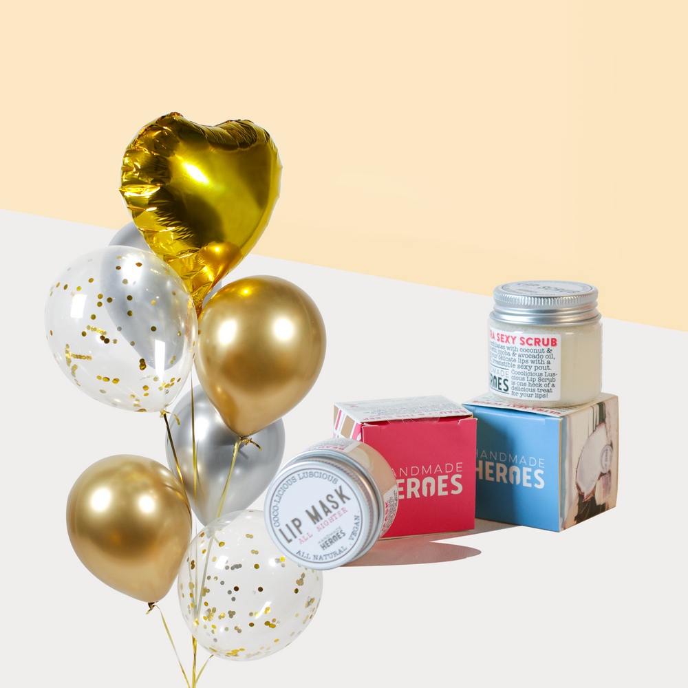 Gold themed balloons bundled with Handmade Heroes lip scrub