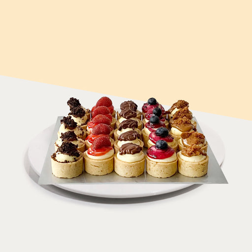 Cheese tartlets with five different flavours of Nutella, Biscoff,  strawberry, blueberry and Oreo