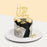 Black buttercream frosted cake, wrapped with silver and gold fondant with edible sugar pearls