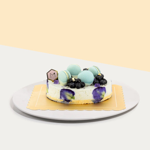 Crunchy biscuit based lime cheesecake, dyed purple with butterfly pea flowers