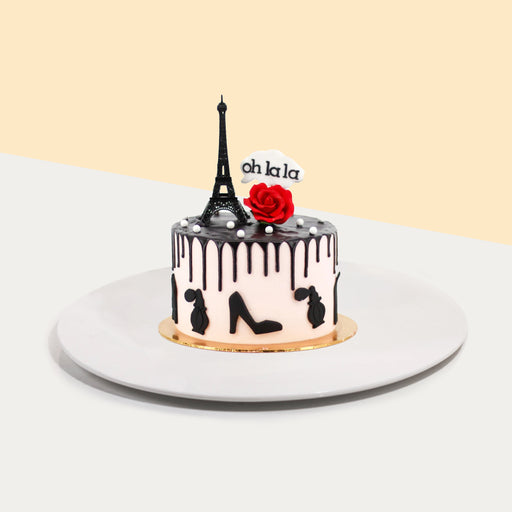 Paris themed cake with an Eiffel tower decoration 
