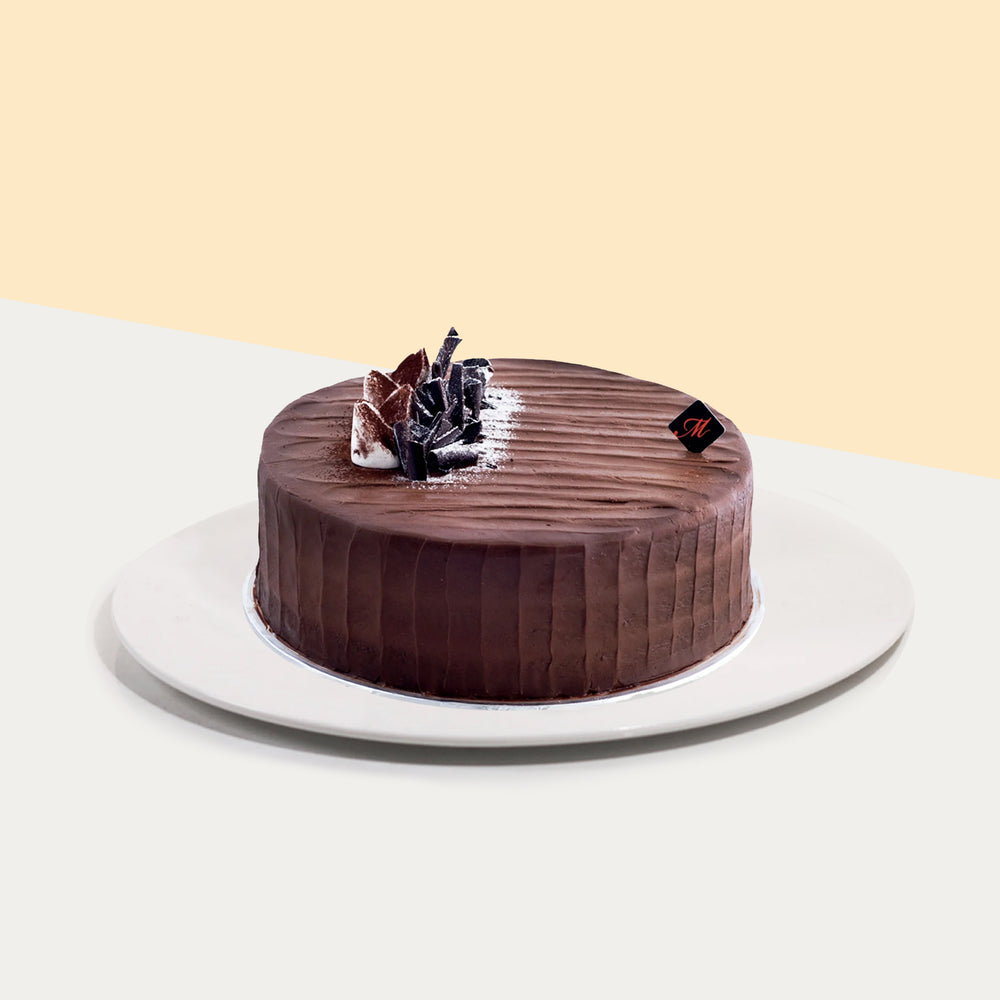 Moist chocolate cake coated with rich chocolate ganache
