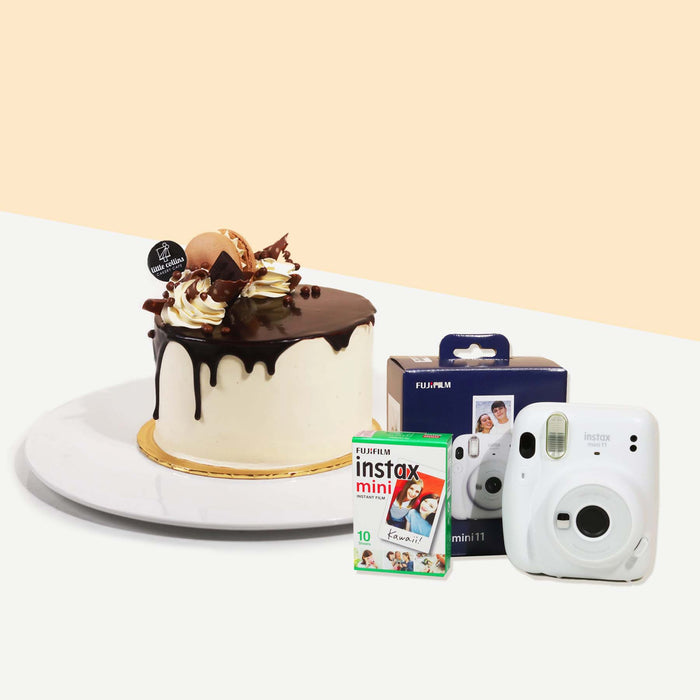 Chocolate hazelnut cake with an Instax Camera and a box of film