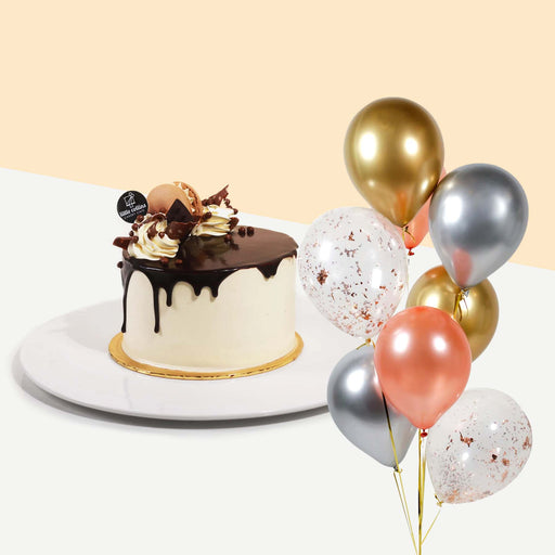 Chocolate hazelnut cake with a bundle of balloons