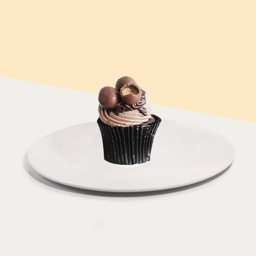 Chocolate cupcakes with chocolate buttercream, ganache drizzle and Maltesers