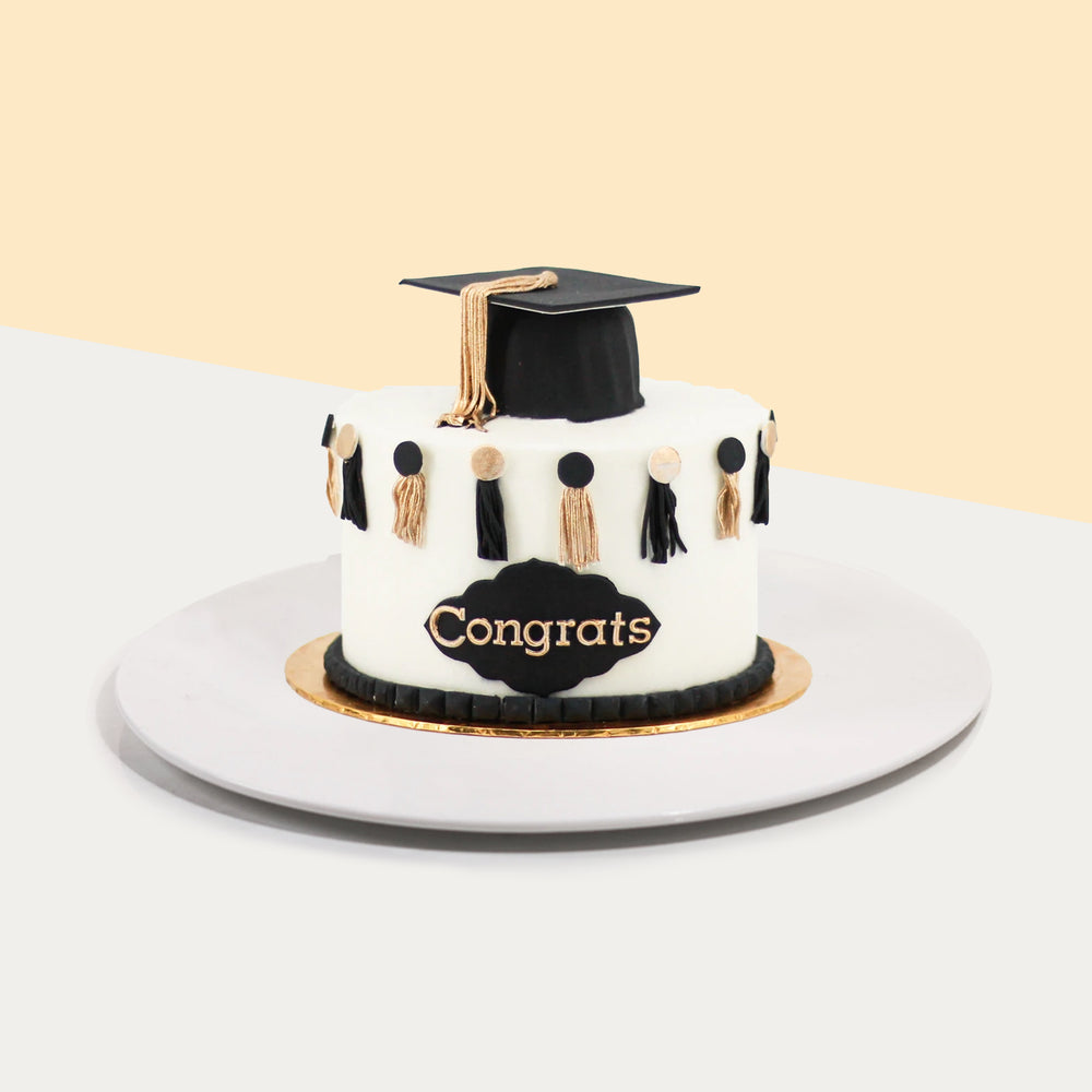 Graduation cake with graduate hat