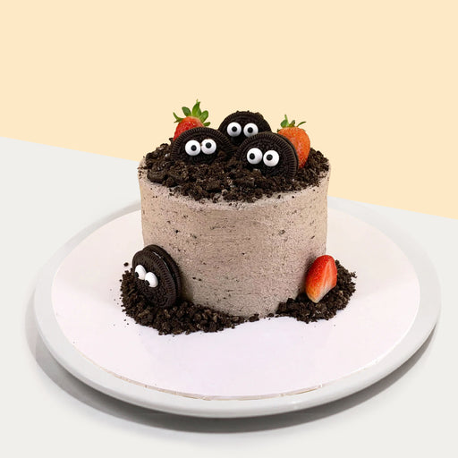 Oreo cake with googly eyes and strawberries