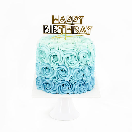 Cake decorated with blue rosette swiss meringue buttercream