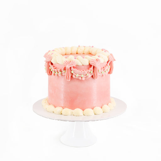 Vintage pink pastel cake, frosted with buttercream