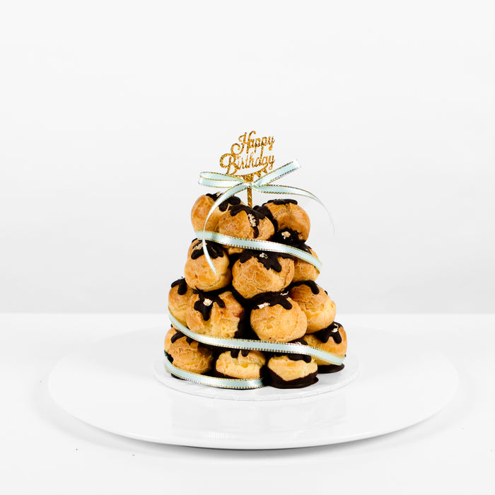 Buttery crispy profiteroles with a variety of fillings, glazed with chocolate