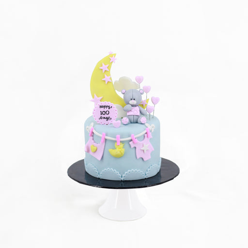 Fondant decorated cake with blue and pink design elements
