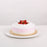 Sponge cake with strawberry jelly pudding, topped with fresh cream and strawberries