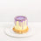 Cake with coconut custard and silky pandan cream, covered in a purple drizzle