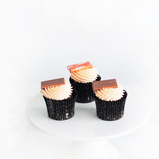 Dark chocolate orange cupcakes with orange curd filling, topped with Andes orange candy