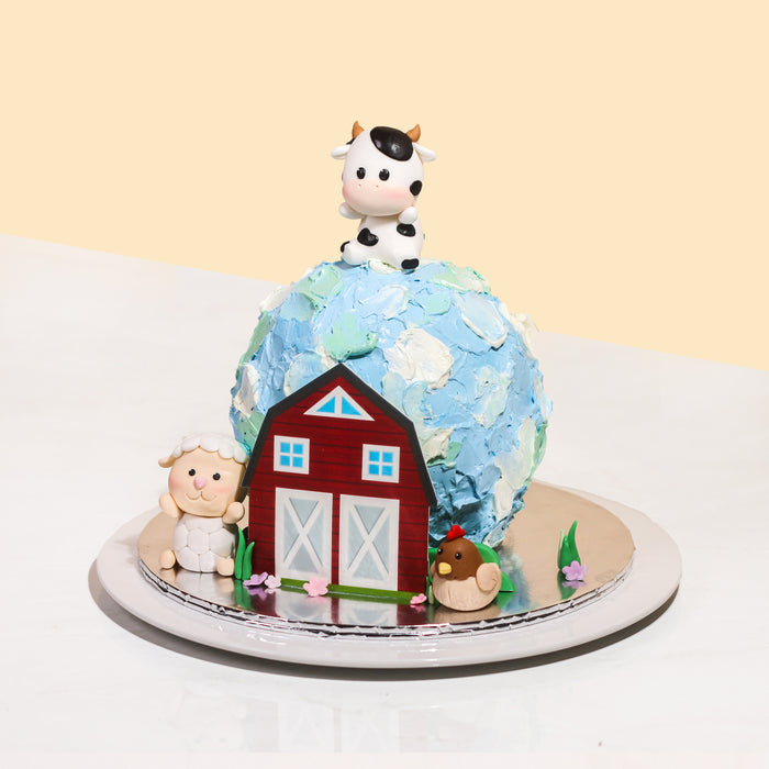 Spherical cake with white, blue and green accents, with Farm animals