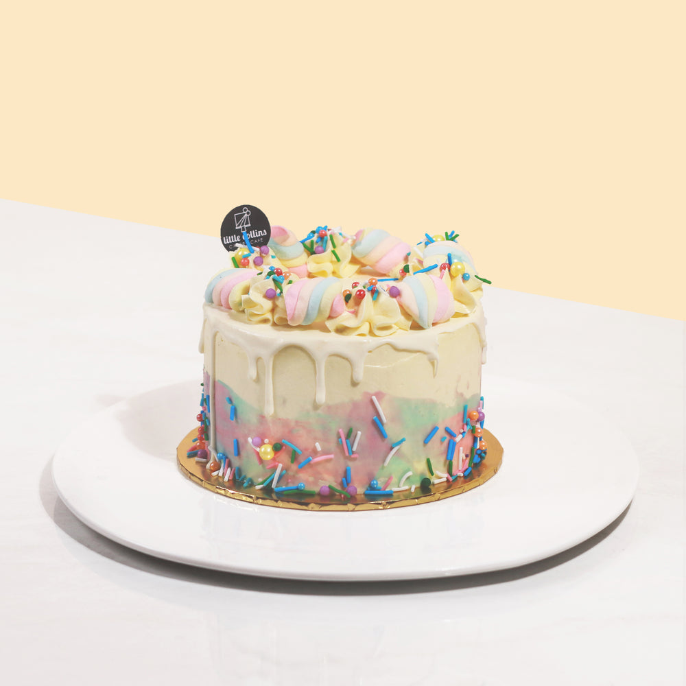 Little Collins rainbow cake, topped with marshmallows