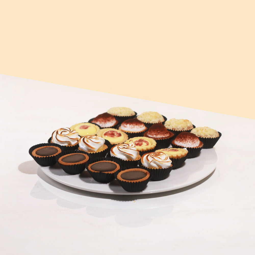 20 assorted tarts with flavours: chocolate, apple crumble, lemon meringue, cheese and banoffee, 4 each