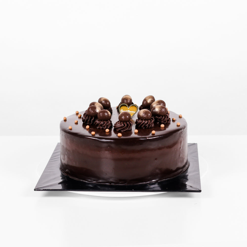 Chocolate sponge cake drizzled in coffee syrup, chocolate ganache and mousse and caramelized Pisang berangan