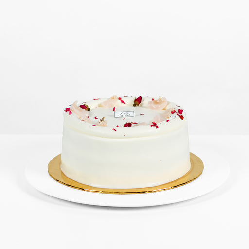 Rose flavoured sponge cake with lychee cream, topped with rose petals
