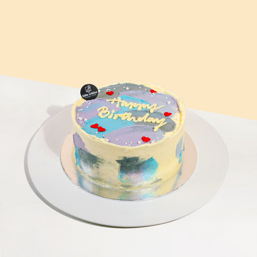 Korean inspired galaxy cake decorated with pastel blue, purple and grey