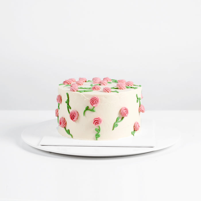 Buttercream cake with hand piped roses
