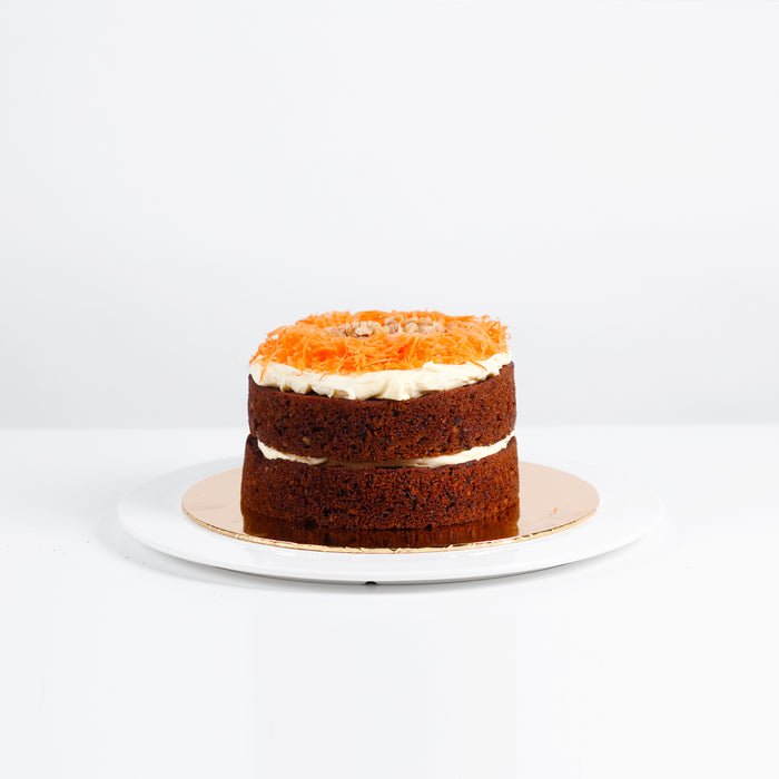 Carrot cake with pineapple and coconut flakes added into the batter, topped with cream cheese
