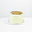 Orange chiffon cake, frosted with whipped cream, topped with passion fruit paste
