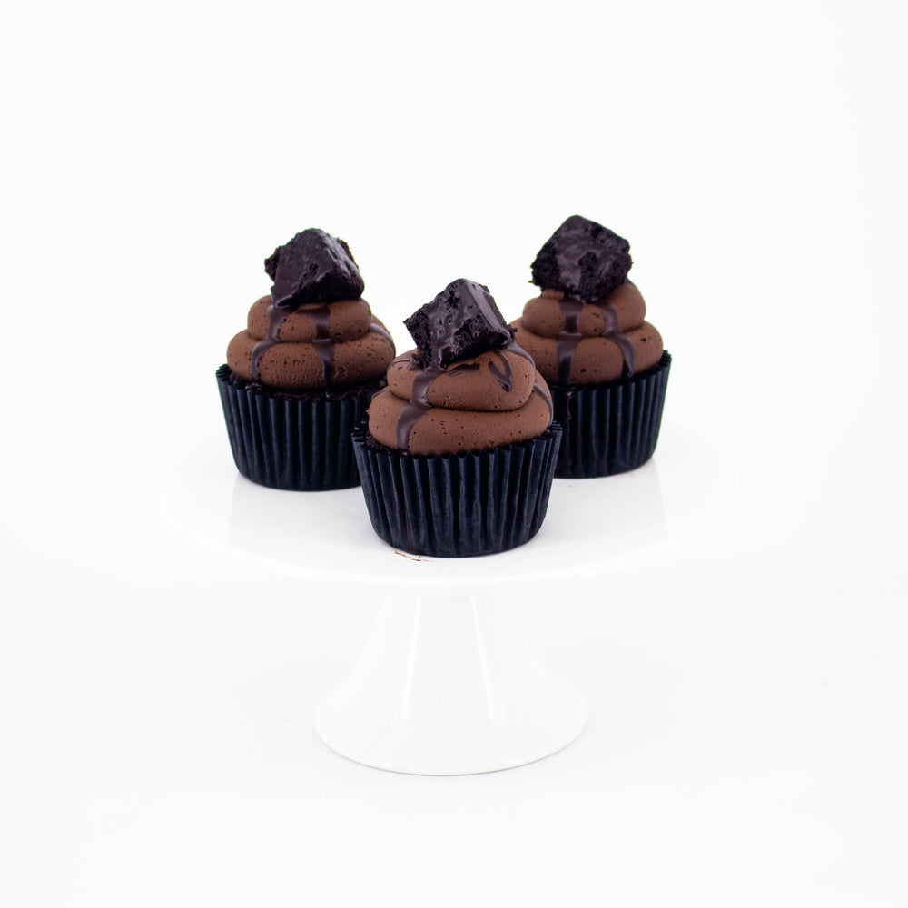 Chocolate sponge cupcakes, topped with chocolate frosting and brownie chunks