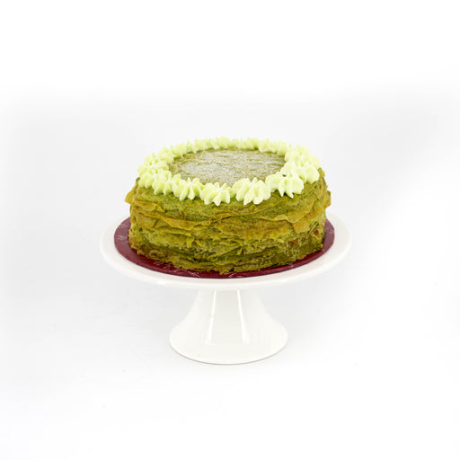 Green mille crepe with matcha powder, and a layer of ganache covered on top