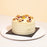 Coconut cake with cream cheese frosting, walnuts, spices and Hawaiian coconut flakes