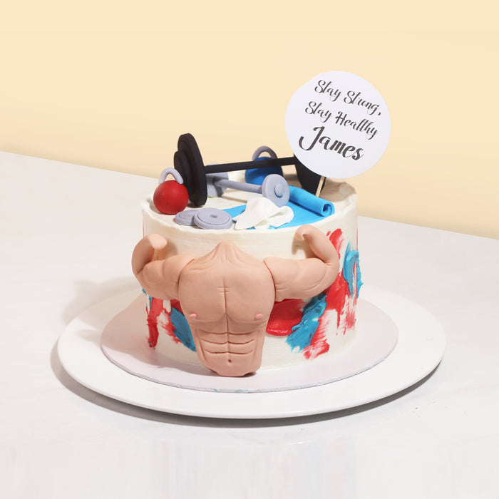 Cake with muscles and weights made of fondant