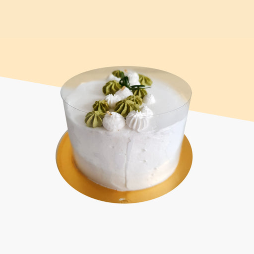 Cream cheese frosted durian cake, with decorated cream swirls
