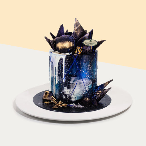 Butter cake with Galaxy themed buttercream, topped with delectable macarons and chocolate shards