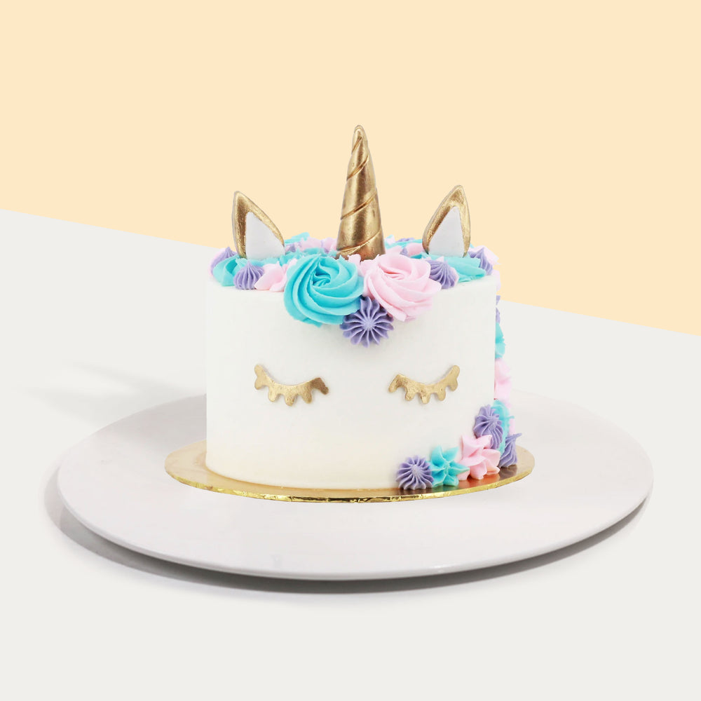 Multi-coloured unicorn cake