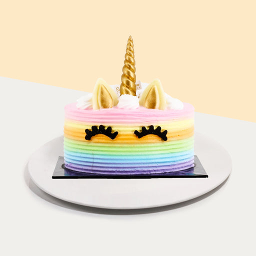 Rainbow cake, with unicorn horn and ears, long with a pair of lashes