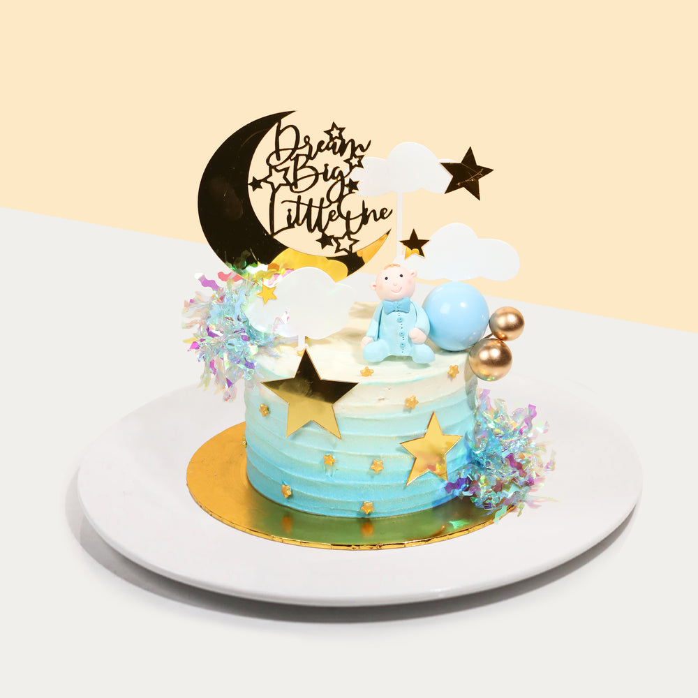 Blue cake with baby boy figurine