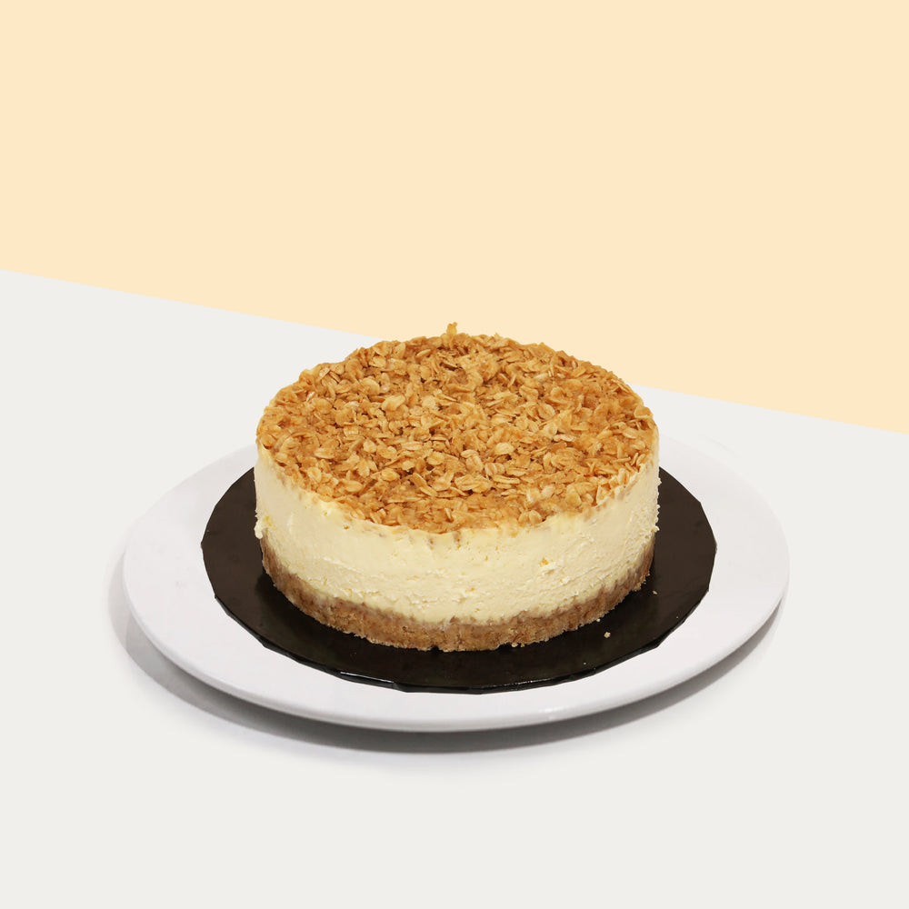 Baked lemon cheesecake topped with oats crumble