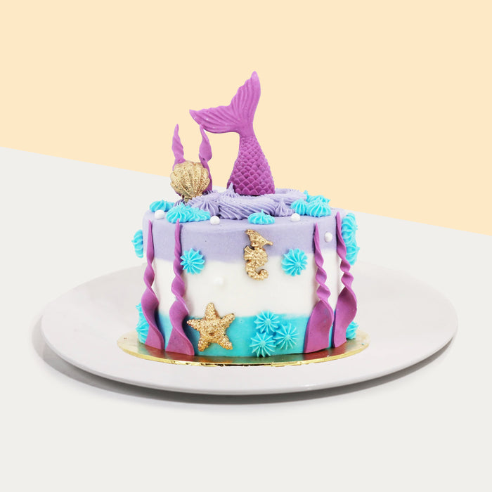 Blue, white and purple buttercream cake, with mermaid tail design