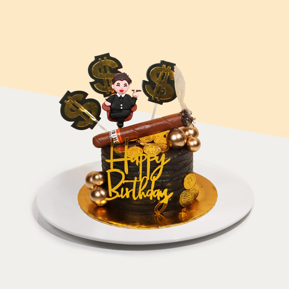 Rich man themed butter cake, topped with a fondant man, cigar and chocolate gold coins