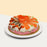 Round sushi cake, topped with salmon, prawns, unagi and ebiko
