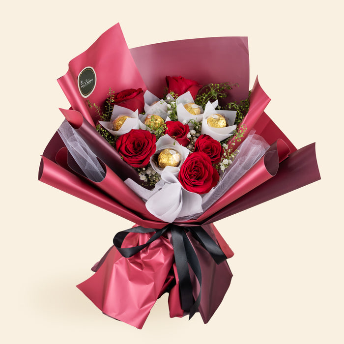 Fresh red roses and Ferrero Rosher bouquet