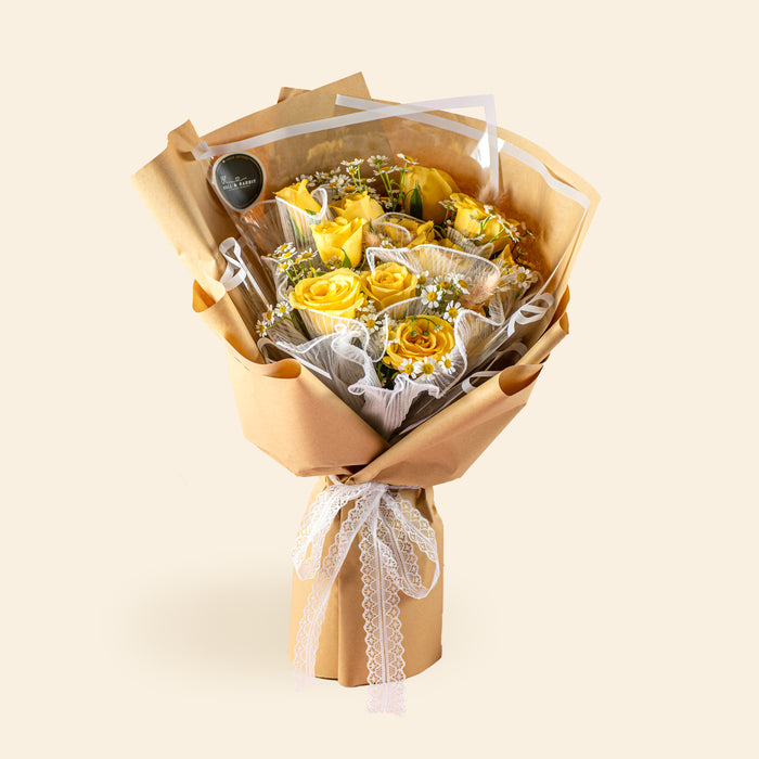 Bouquet with yellow roses and chamomile