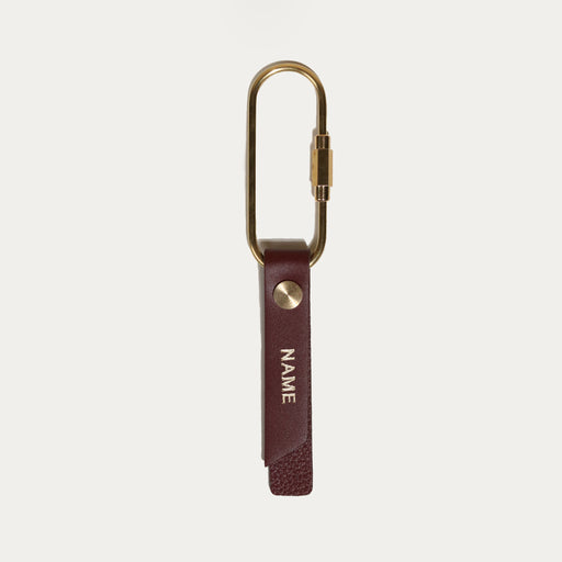 Brown leather and brass keyring with engraving