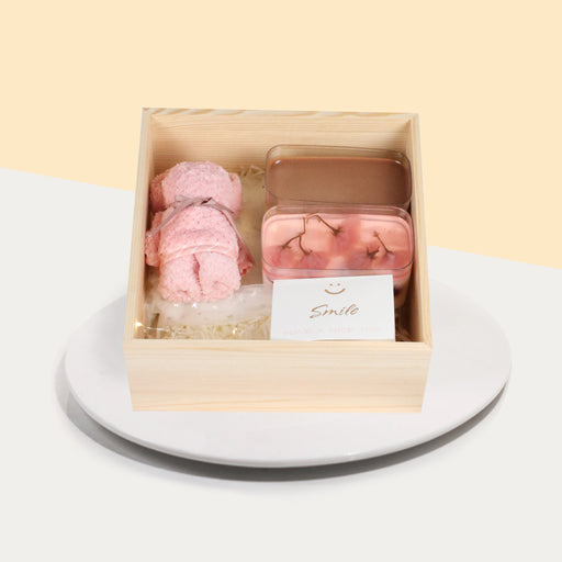 Gift box with two box cakes with Sakura Cherry Yogurt and Avocado Chocolate, and a teddy bear shaped towel