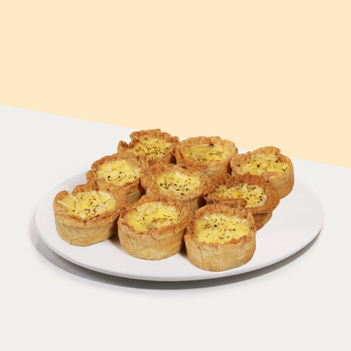 Nine pieces of quiche loaded with chicken, mushroom and cheese